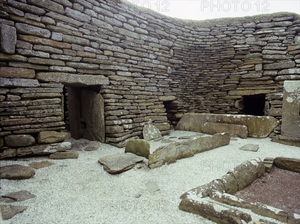 View of the interior of House 1, through the door