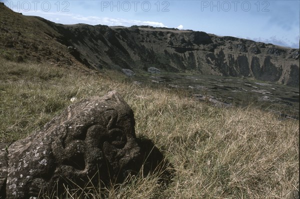 Bird-Man petroglyph by the edge of crater of Rano Kao volcano