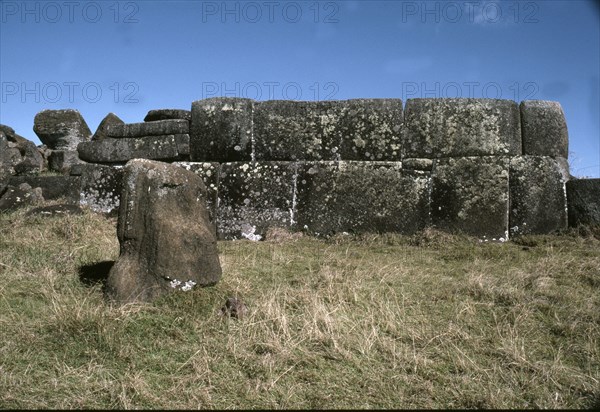 The so-called "Inca-style" masonry at Ahu Vinapu, with a half buried Moai head in the foreground