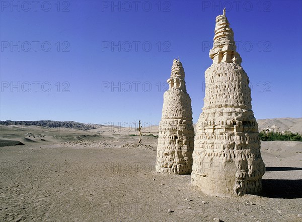 Dagodas near the site of the Mogao Caves, also known as the Thousand Buddha (Quinfodong) Caves, Dunhuang