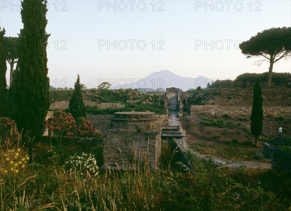 Tombs beyond the walls of Pompeii, with Vesuvius in the background