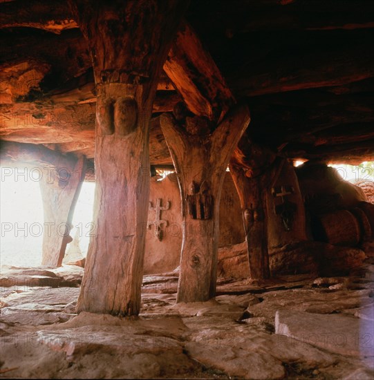 Alligned to the four cardinal points and roofed by a thick layer of millet stalks, the men's house or Togu Na, is the focal point of male society in every Dogon village