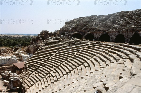 View of the upper rows of seats and arches of the supporting wall of the theatre at Side