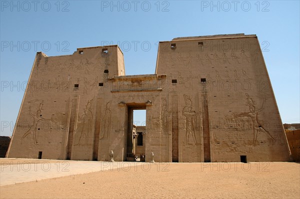 The Pylon with reliefs of the Pharaoh Ptolemy XII (Avletes) smitting his enemies in the presence of Horus the Elder