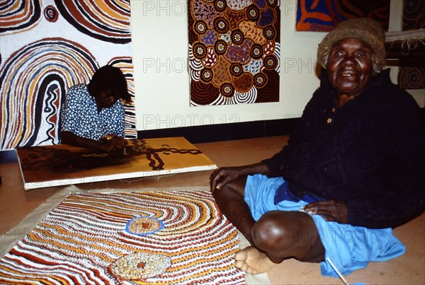 Balgo Community artist, the late Mati Mudgedell, working on a dot painting at the Warlayirti Culture Centre in the north-west desert region of Western Australia south of Halls Creek