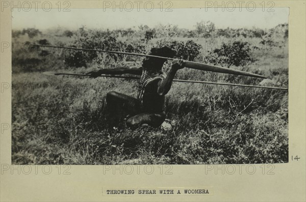 Aboriginal man throwing a spear with a woomera