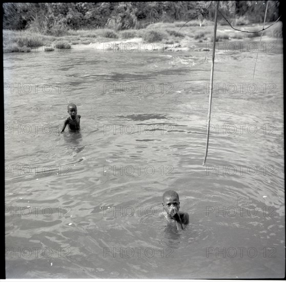 Abange's son with Banyu in river