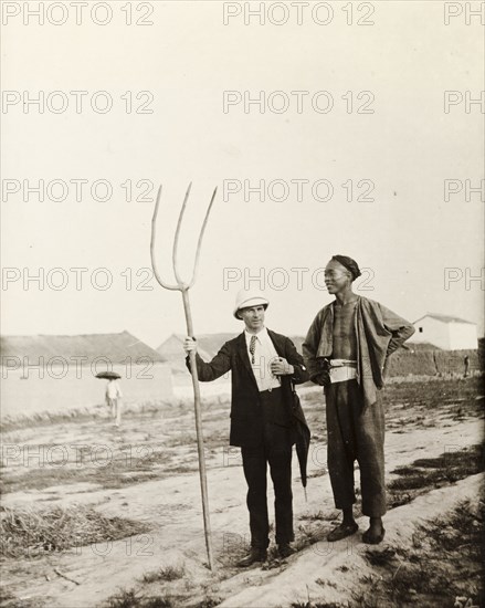 European man with Chinese farming tool