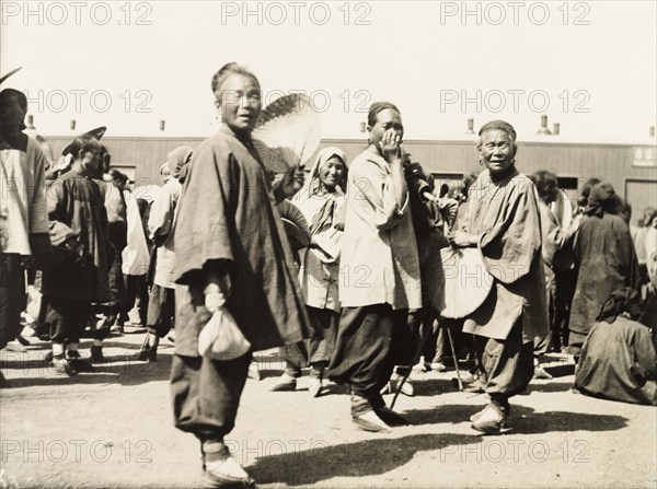 Women with bound feet on station