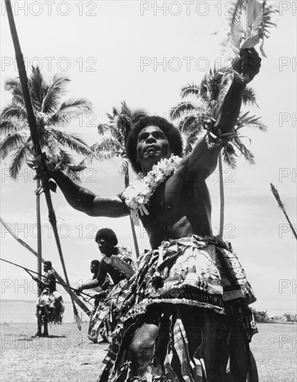 Men perform a 'meke wesi'