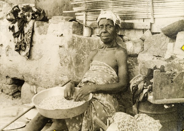 An elderly street vendor in Accra