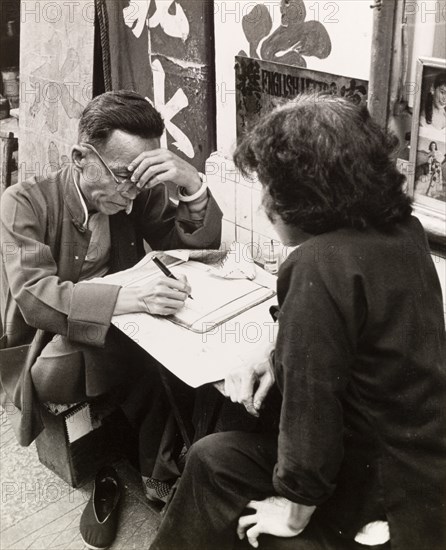 Letter-writing service on a Hong Kong street