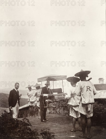 Two doctors with a sedan chair