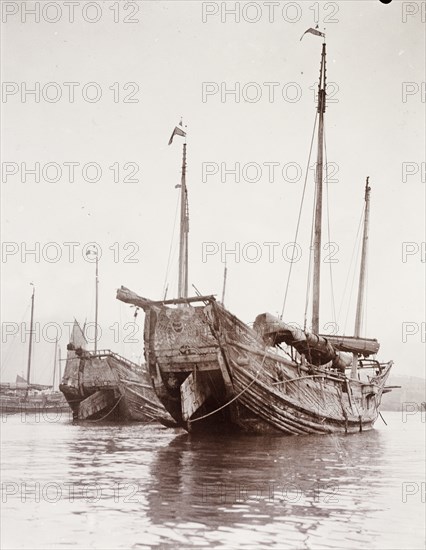 Junks moored at a Hong Kong harbour