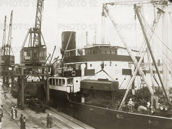 Unloading locomotive tender from the SS Harmonides