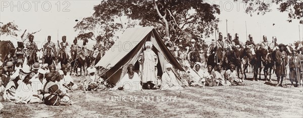 Emir of Katsena standing outside tent