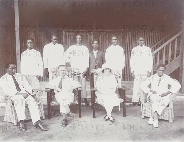 Posed photograph showing Mr & Mrs Baxendale of Miller Bros with staff