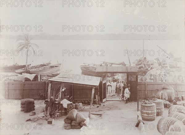 View from bungalow at Badagry showing barrels of oil and bags of nuts