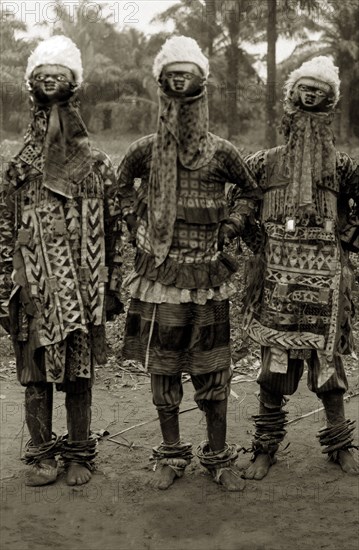 Four JuJu men in their costumes