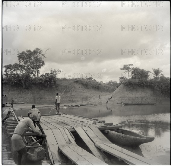 Journey from Ibadan to Cameroons, Bansara ferry, overseer refuses to have his picture taken