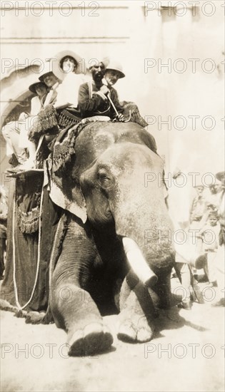 Europeans take an elephant ride