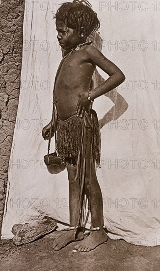 Portrait of a young girl dressed in a grass skirt