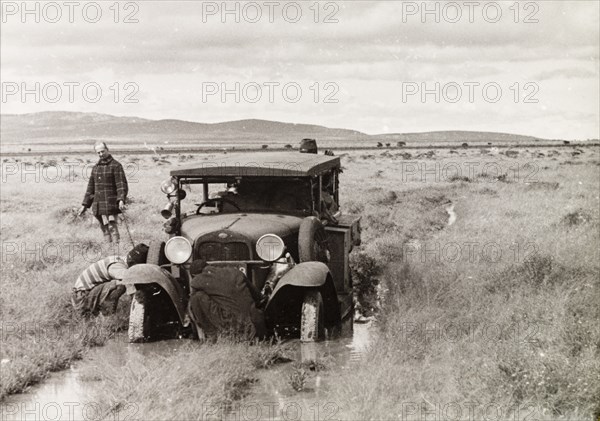 Car stuck in flooded plains