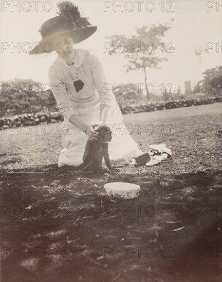 Lady with a chained monkey