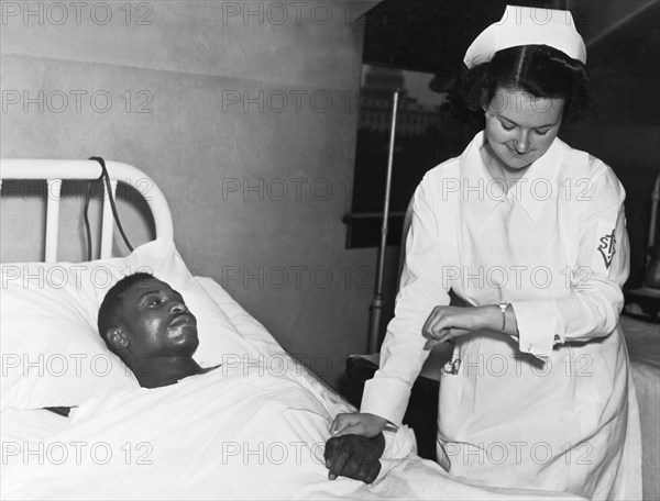 Nurse Taking Man's Pulse