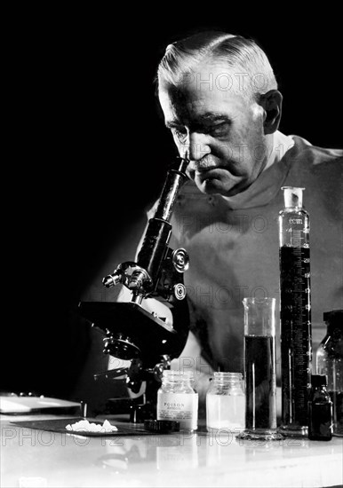 Scientist With Microscope