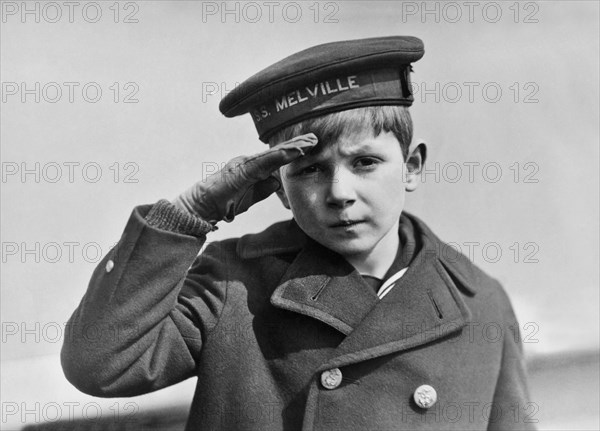 A Young Boy Saluting