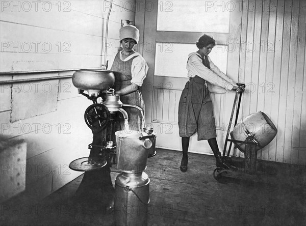 Two Women Making Butter