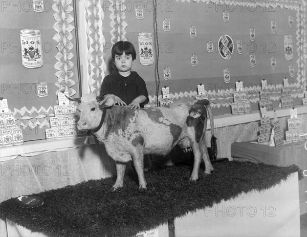 Young Girl With Pet Cow