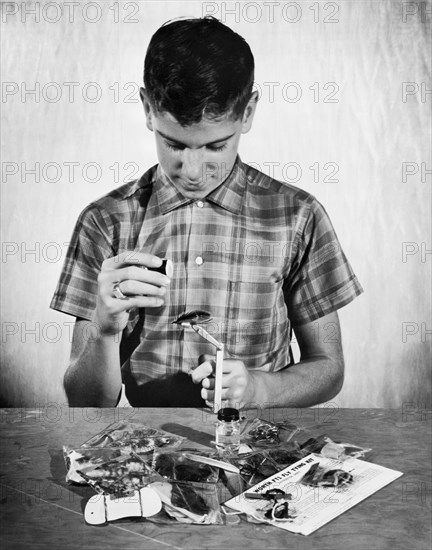 Boy Learning To Tie Flies