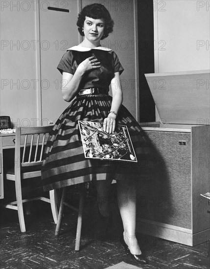 A Woman Listening To Records