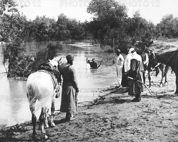 A Man Baptized In A River