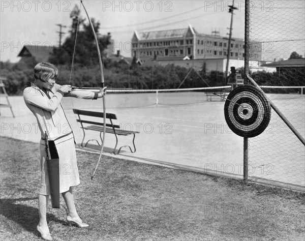 Actress Shooting An Arrow