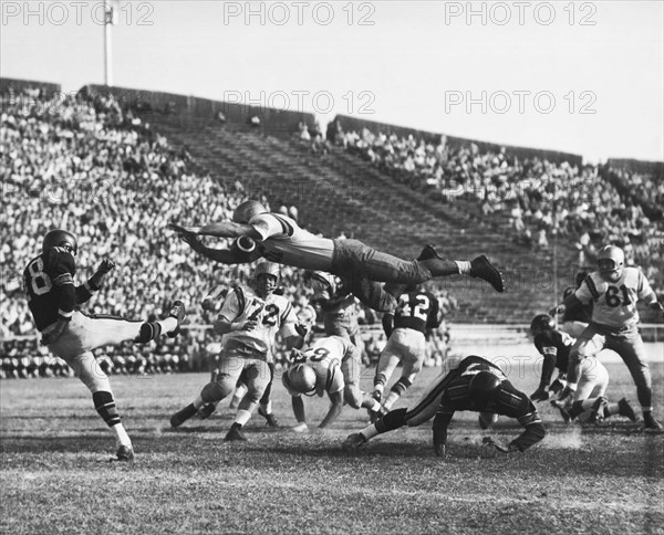 Player Blocks Football Punt