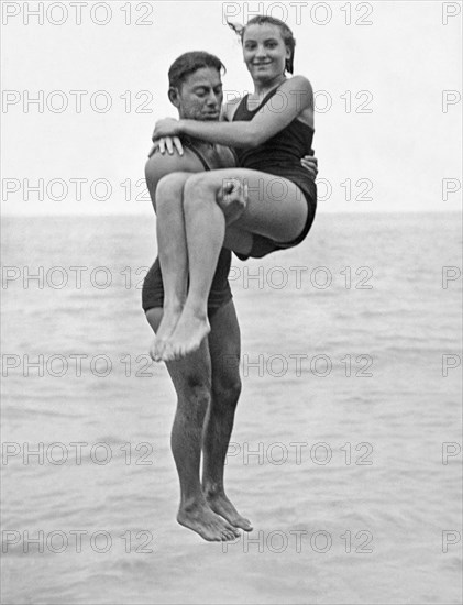 Couple Tandem Leaps Into Lake