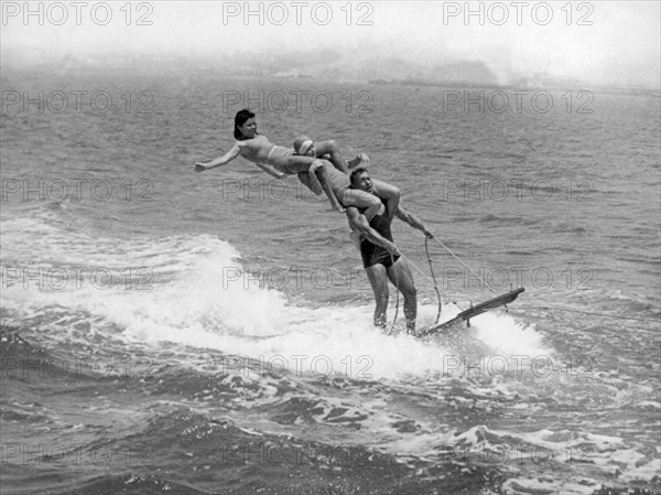 San Diego Bay, California  c. 1926  
This triple stack was doomed when the top passenger lost her balance while riding on an aquaplane.
