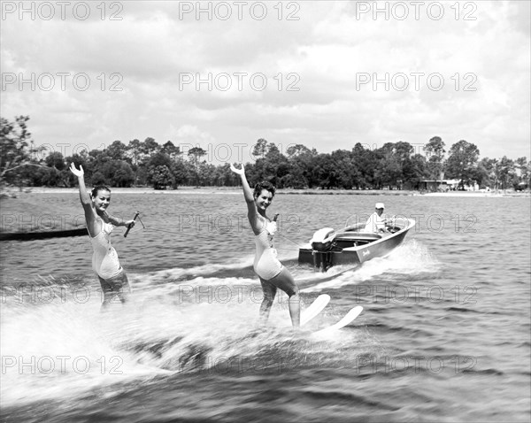 Women Water Skiers Waving