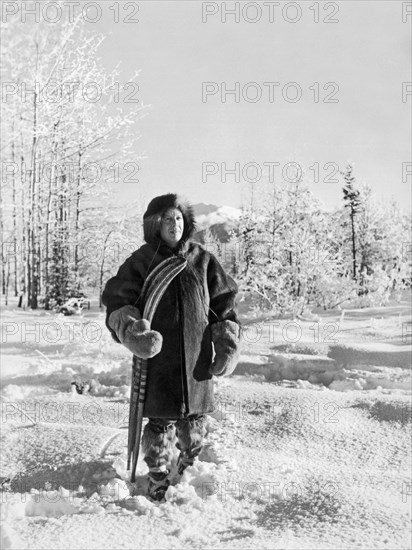 Man With Parka And Snowshoes