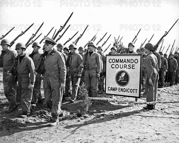 Camp Endicott, Rhode Island:  March 27, 1943.
U.S. Navy Seebees on the march at Camp Endicott where they are being trained in Commando tactics.