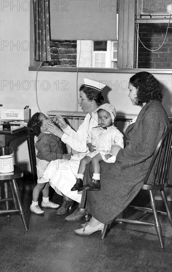 School Nurse Checks Child