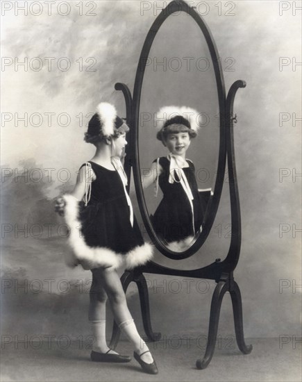 A Young Girl In A Mirror