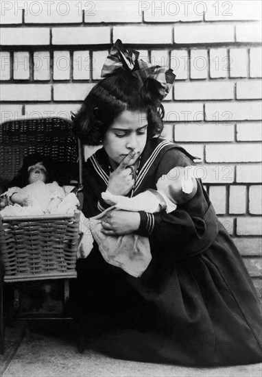 Young Girl With Dolls