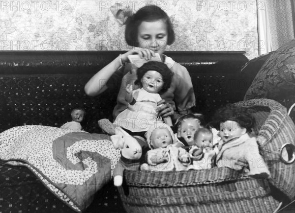 Girl With Dolls