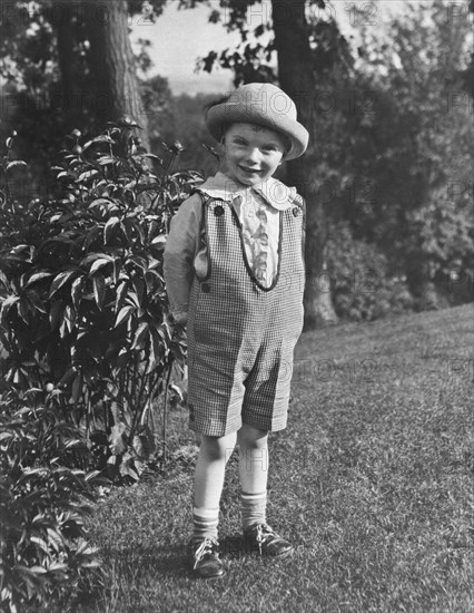 Small Boy Poses In Yard