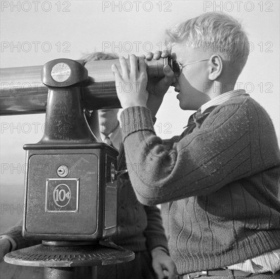 Boy Looking Through Telescope