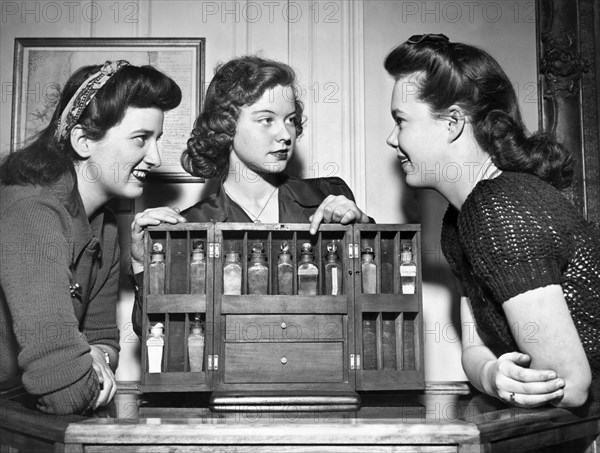 Three Women Examine Exhibit